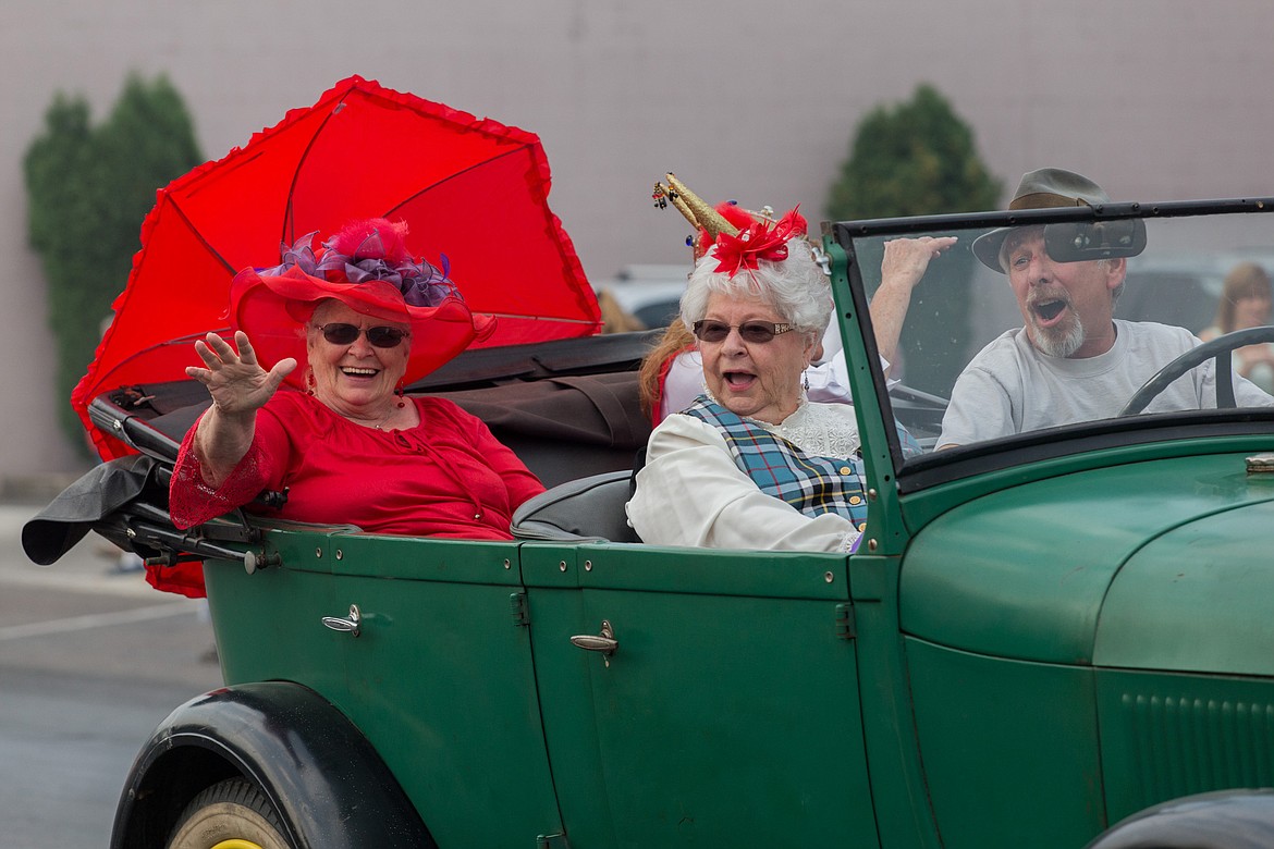 Marvel Thomas, left, Sandy Craft and Scott Thompson ride in the 2017 Nordicfest Heritage Festival parade on Saturday, Sept. 9, 2017. (John Blodgett/The Western News)