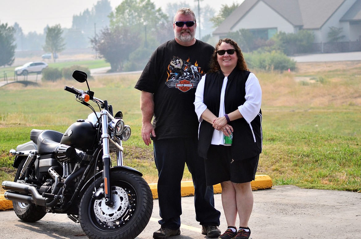 Quinton and Audrey of Plains are enjoying the show with their 2013 Harley Davidson Dyna Fat-bob. Only two months new to Plains, they say the car and bike shows are a gret way to meet new friends. (Erin Jusseaume/ Clark Fork Valley Press)