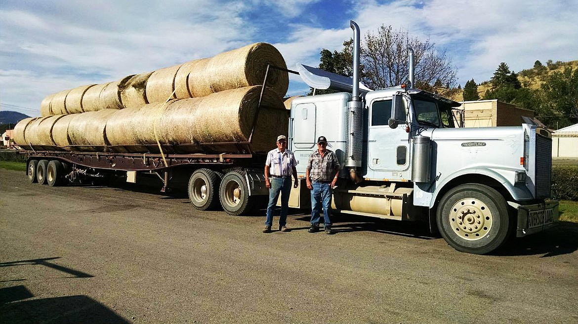 With 30 tons of hay loaded for East Montana ranchers, the Cummings brothers do their part to help. (Lisa Larson/ Clark Fork Valley Press)