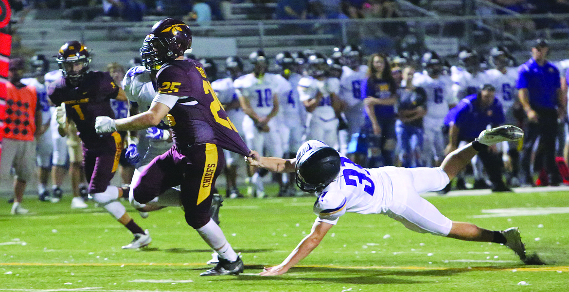 Connor Vanderweyst/Columbia Basin Herald
Moses Lake's Brandon Swett shakes off a Hanford tackler to score a 19-yard touchdown.