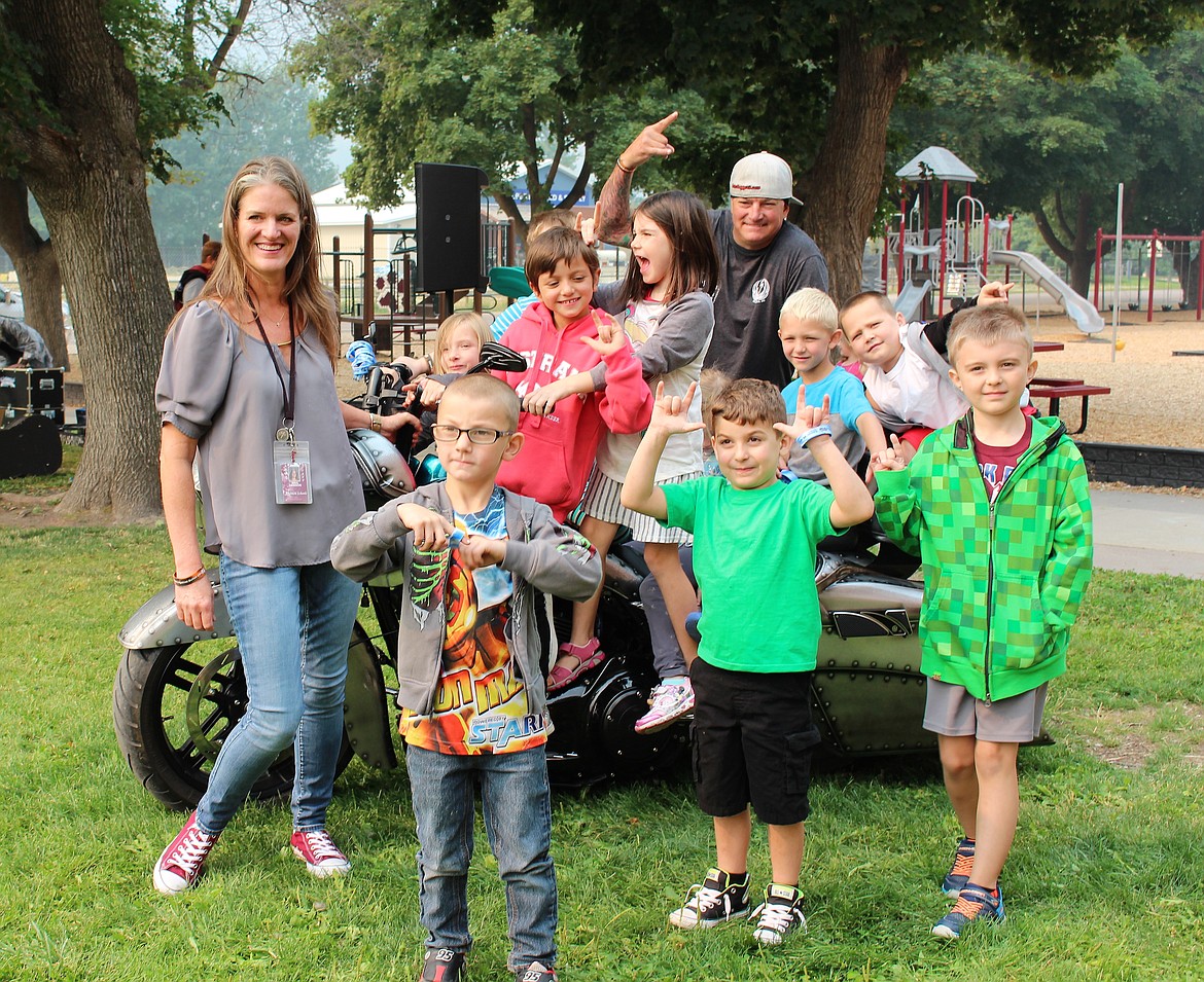 Alberton&#146;s first grade teacher Debbie Hanson and her students were able to get up close and even sit on a Harley Davidson motorcycle with rider Dave Withrow during a Bikers Against Bullies presentation on Thursday, Sept. 7. (Photo by Jessica Maurer)