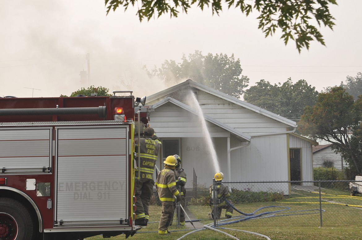 Fire crews from Polson Fire Department, Polson Rural Fire Department and Finley Point Volunteer Fire Department answered a call on Sept. 6 of a house fire in Polson, which was caused by a grill in the backyard. (Ashley Fox/Lake County Leader)