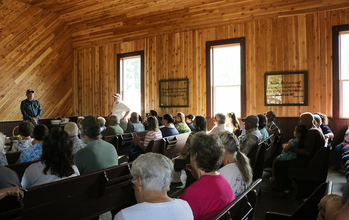 Photos by Mandi Bateman
Larry Hall tells the story of the Little White Church project.