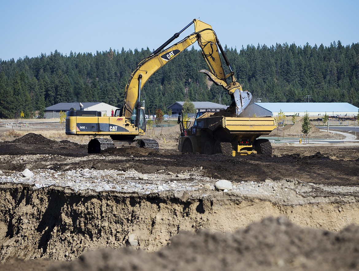 LOREN BENOIT/PressAn excavator pours dirt into a dump truck Thursday afternoon at the Hayden North development site off of Lancaster. Hayden grew 2.8 percent last year and is projected to grow about 1.2 percent this year.