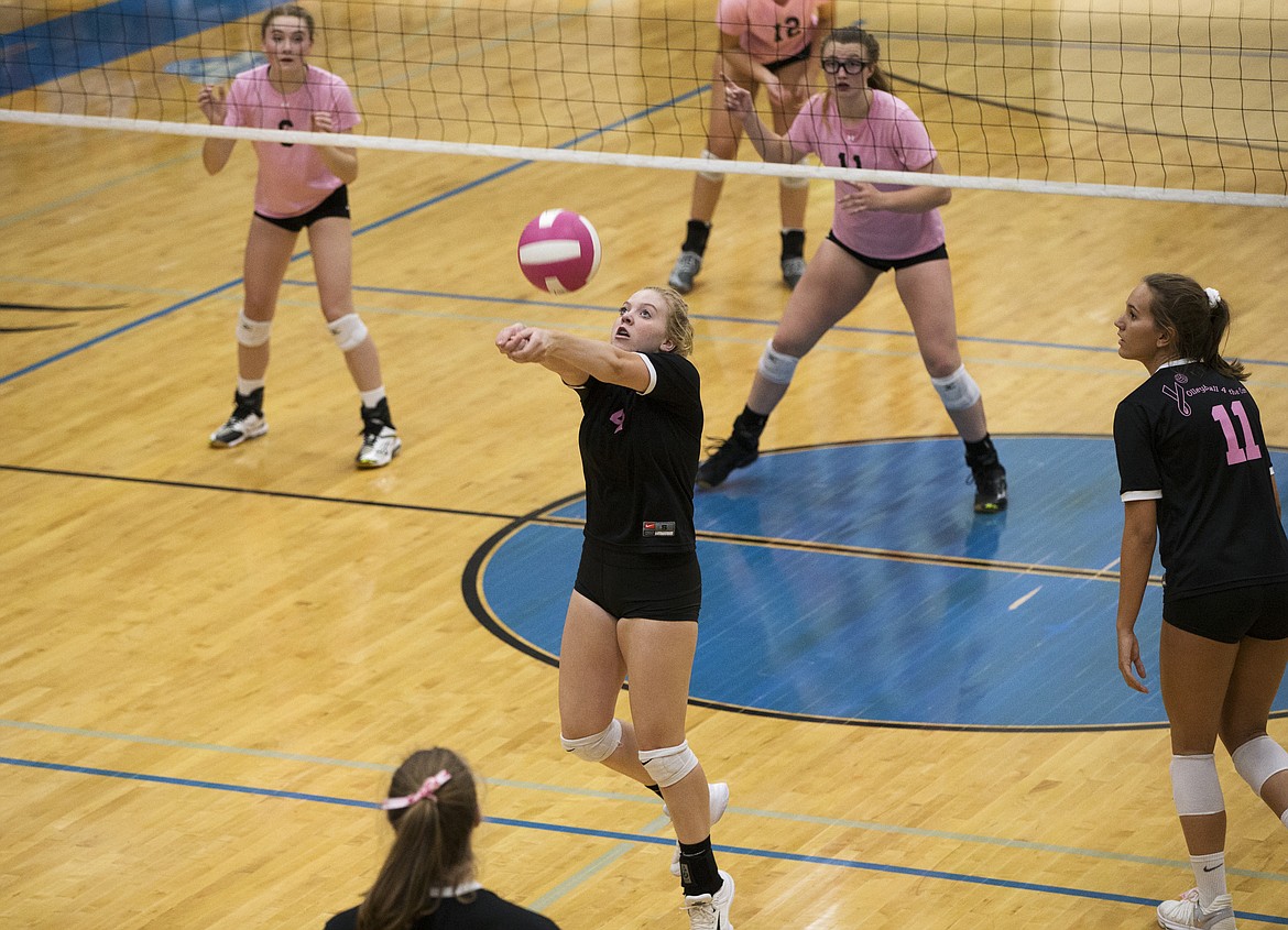 LOREN BENOIT/Press

Post Falls&#146; Kayla Mayo hits the ball in the air for a teammate during Volleyball for the Cure Thursday night at Coeur d&#146;Alene High School.