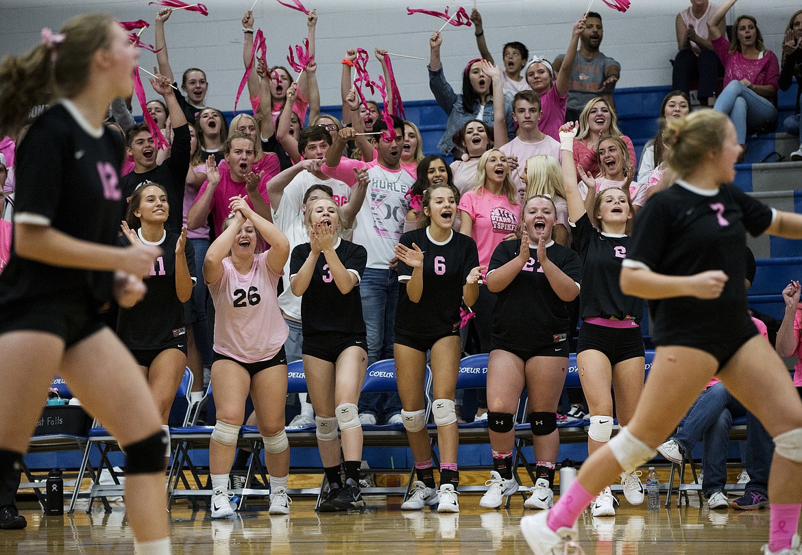 LOREN BENOIT/Press

The Post Falls bench and student section celebrate a point against Coeur d&#146;Alene during Thursday night&#146;s Volleyball for the Cure.