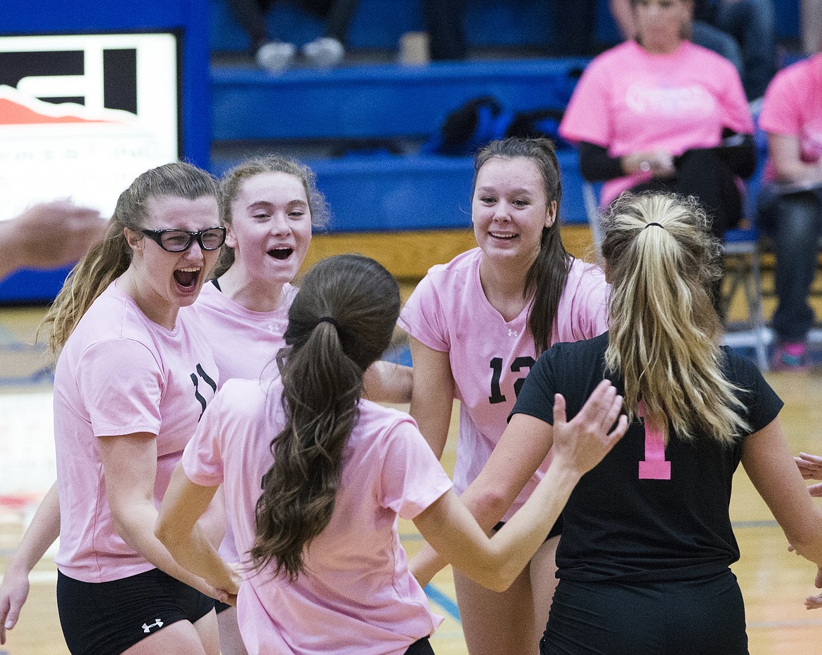 LOREN BENOIT/Press

The Coeur d&#146;Alene volleyball team celebrates a point against Post Falls during Thursday night&#146;s Volleyball for the Cure.