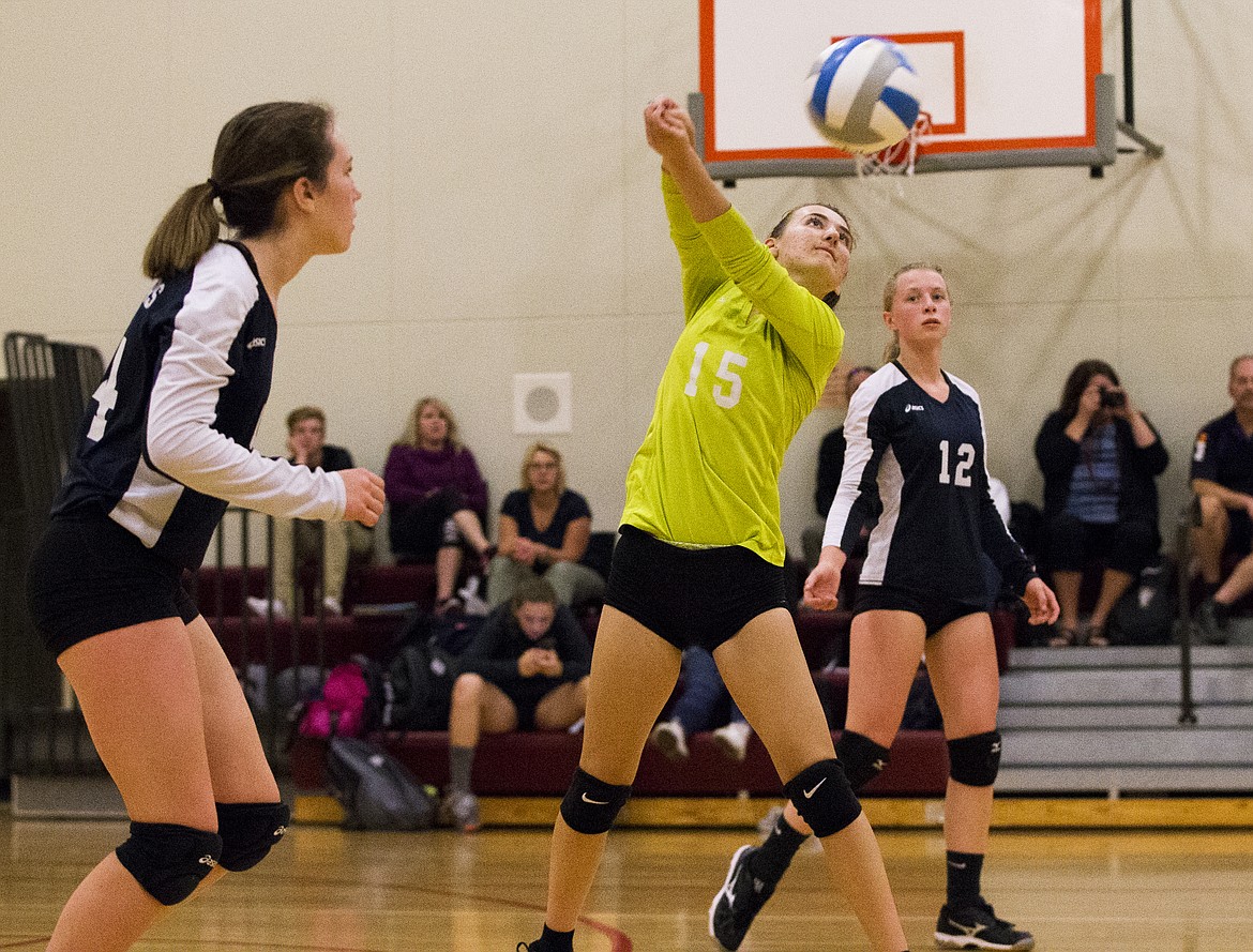 LOREN BENOIT/Press

Hannah Burt of Coeur d&#146;Alene Charter Academy hits a volley back over the net to an opponent in a match Tuesday night at Holy Family Catholic Church.