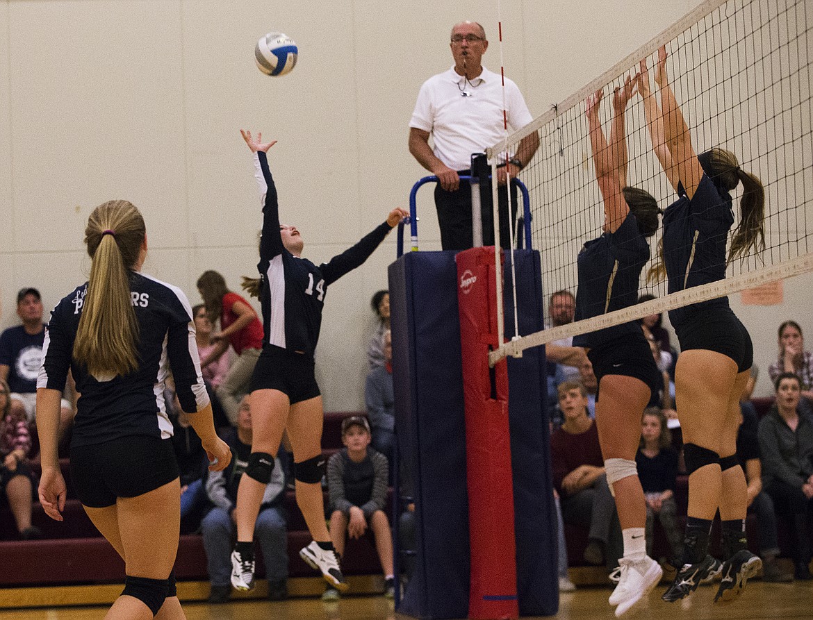 LOREN BENOIT/Press

Coeur d&#146;Alene Charter&#146;s Rylee Peterson hits a ball over the net against Timberlake on Tuesday at Holy Family Catholic Church.