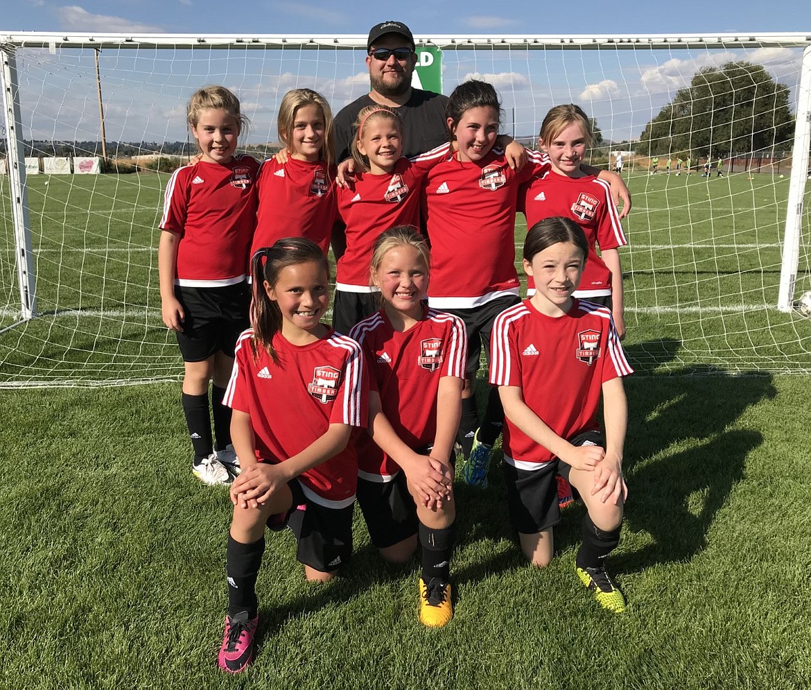 Courtesy photo
The Sting Timbers FC girls &#145;08 green soccer team dropped a pair of soccer games in Yakima on Saturday. In the front row from left are Savannah Rojo, Anna Ploof and Eleanor Moss; second row from left, Izabella Entzi, Elizabeth Montgomery, Ella Pearson, Hannah Shafer and Cameron Fischer; and rear, coach Dan Ploof.