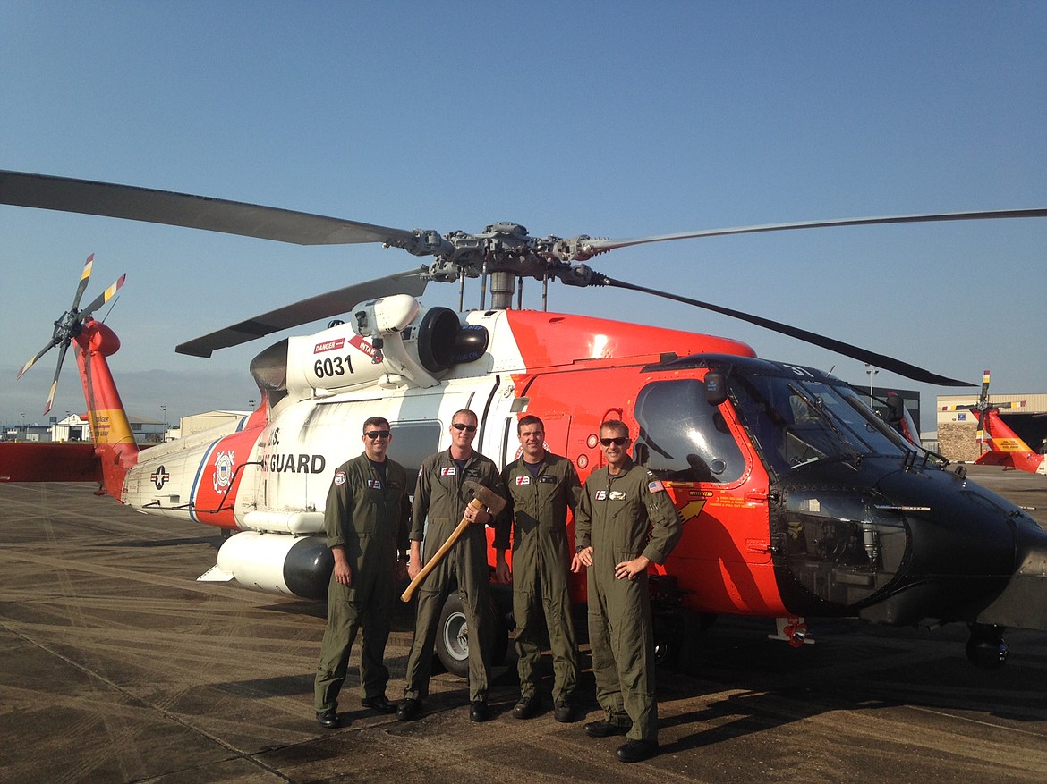 Whitefish High School alum, Justin Pacheco (second from left) is pictured alongside the MH-60 Tango he pilots for the U.S. Coast Guard. (Courtesy of Justin Pacheco)