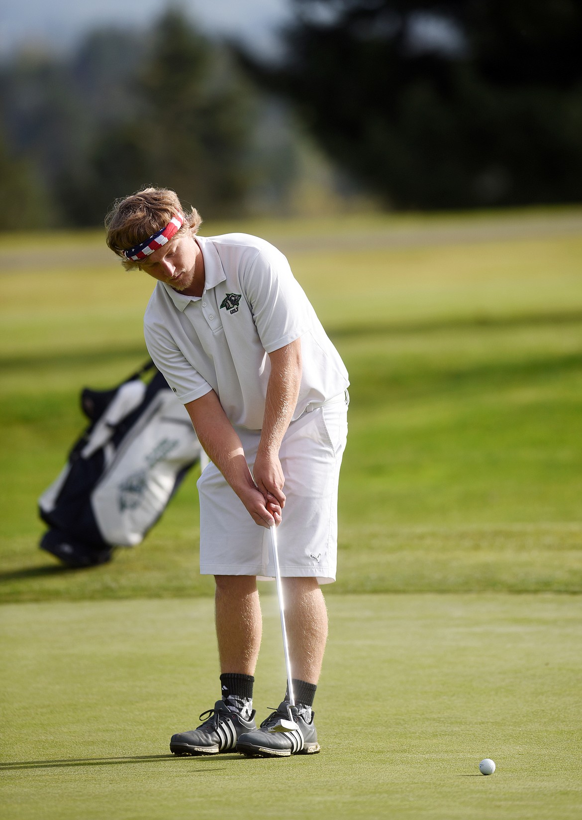 Glacier senior Brayden Aurich putts during the final round of the Class AA State Golf Tournament on Wednesday at Buffalo Hill Golf Club.