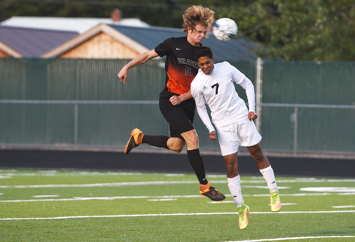 Flathead defender Camas Rinehart and Glacier forward Rohit Tappeta challenge each other for a ball during the second half of the 3-3 tie at Legends Stadium on Tuesday. (Aaric Bryan/Daily Inter Lake)