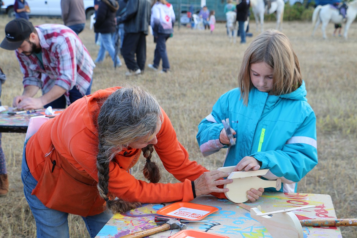 (Photo by MARY MALONE)
Local youth gathered around the Home Depot tables to craft different items out of wood during Ponderay Neighbor Day on Saturday.