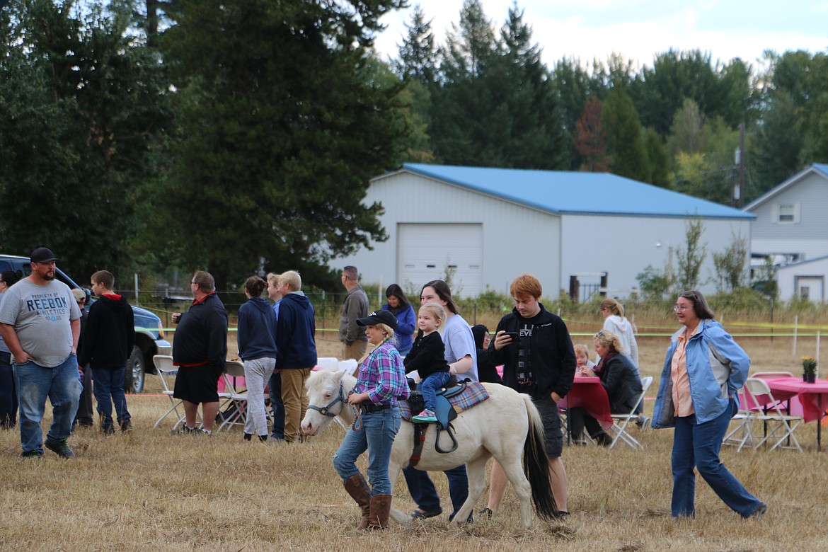 (Photo by MARY MALONE)
A youngster gets a pony ride during Ponderay Neighbor Day Saturday.