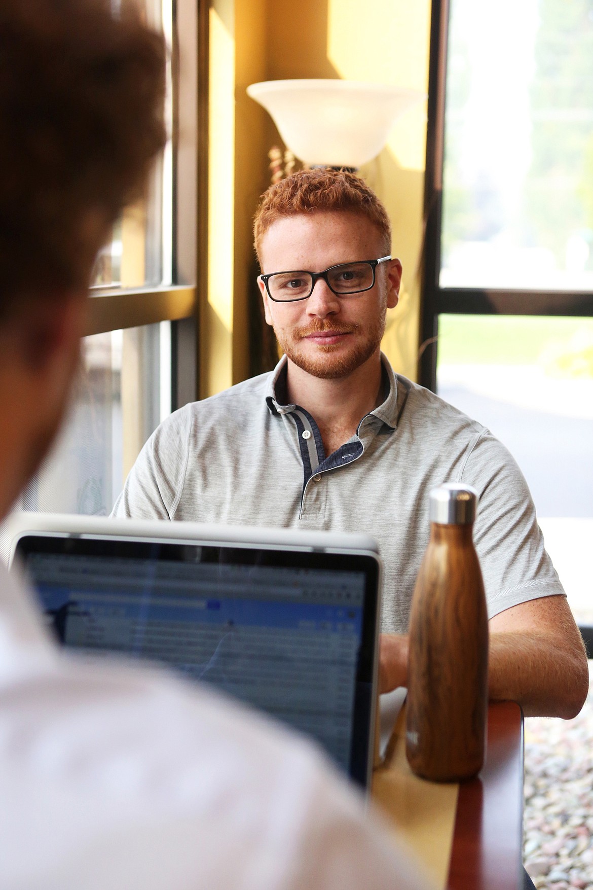 Expesicor COO and board chairman David Booth works on a grant application to fund the company&#146;s research of neurodegenrative diseases at City Brew Coffee in Kalispell. (Mackenzie Reiss/Daily Inter Lake)