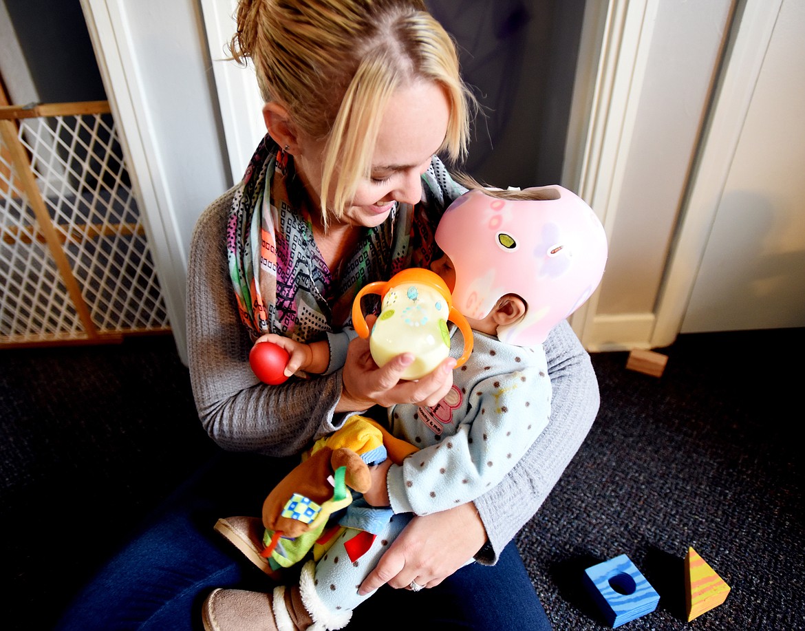 Kailey Hofstee feeds Piper Bardell in the infant room at Marlyn&#146;s Center for Children &amp; Families.
(Brenda Ahearn/Daily Inter Lake)