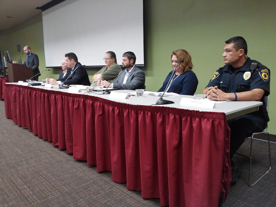 STEVE CAMERON/Press
From left, moderator Brian Seguin, NIC librarian; Eugene Marano, retired Kootenai County judge; Clark Peterson, Kootenai County magistrate judge; Eva White, chief justice for the Coeur d&#146;Alene Tribe; Tyrel Stevenson, CdA Tribe legislative director and former public defender; Mary Wolfinger, Kootenai County coordinator of the county mental health court; and Mario Rios, training officer with the Coeur d&#146;Alene police department helped put a human face on the book &#147;Just Mercy,&#148; by Bryan Stevenson.