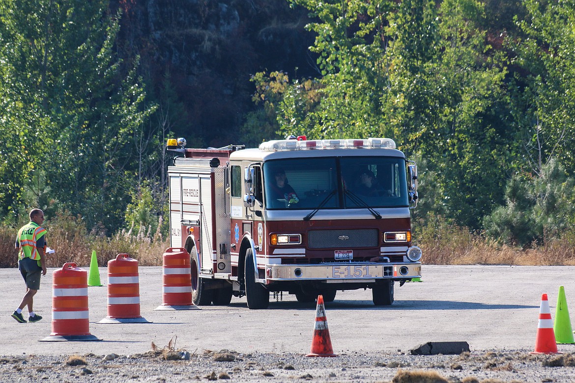 Photo by Mandi Bateman
North Bench Firefighter Granite Allinger navigates through the Emergency Vehicle Driver Training course with his instructor, South Boundary Fire Chief Tony Rohrwasser, paying close attention.