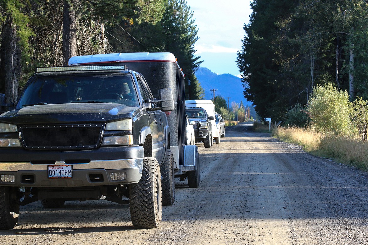 Photo by Mandi Bateman
Rescue vehicles line the road in Naples on September 18, attempting to rescue several horses, but only one left that day.