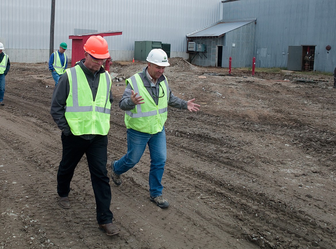 F.H. Stoltze land and Lumber general manager Chuck Roady and Congressman Greg Gianforte, R-Mont., talk during a tour of the company&#146;s plant Friday.