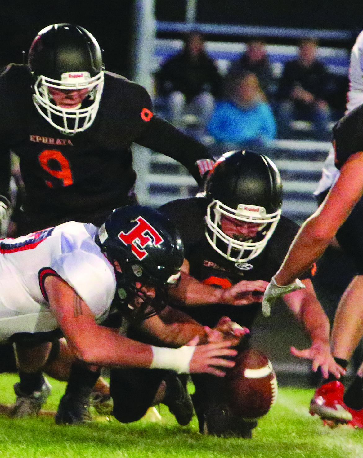 Connor Vanderweyst/Columbia Basin Herald
Ephrata recovers an Ellensburg fumble in the first quarter on Friday.
