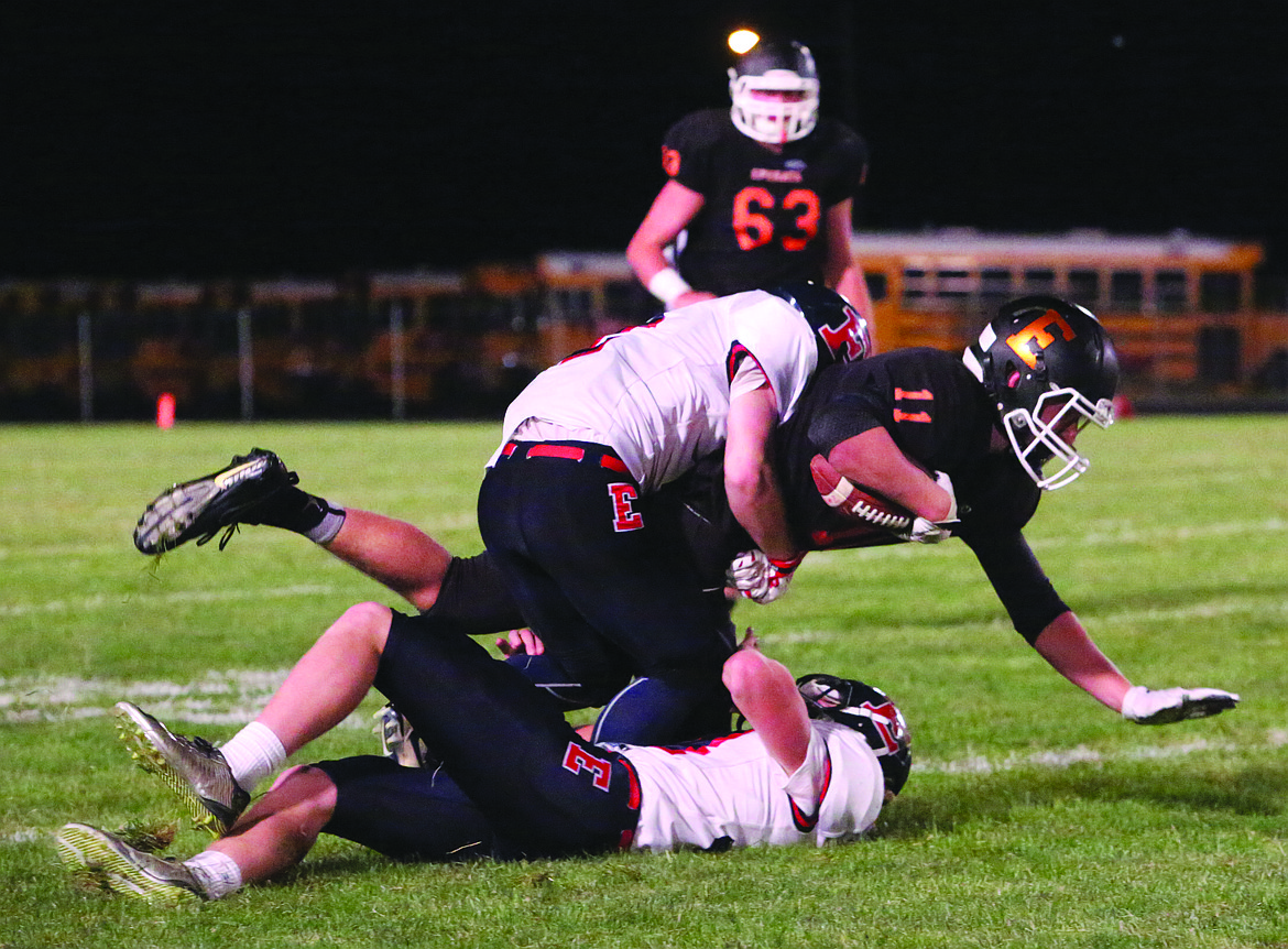 Connor Vanderweyst/Columbia Basin Herald
Ephrata wide receiver Jake Oxos is tackled after a catch against Ellensburg.