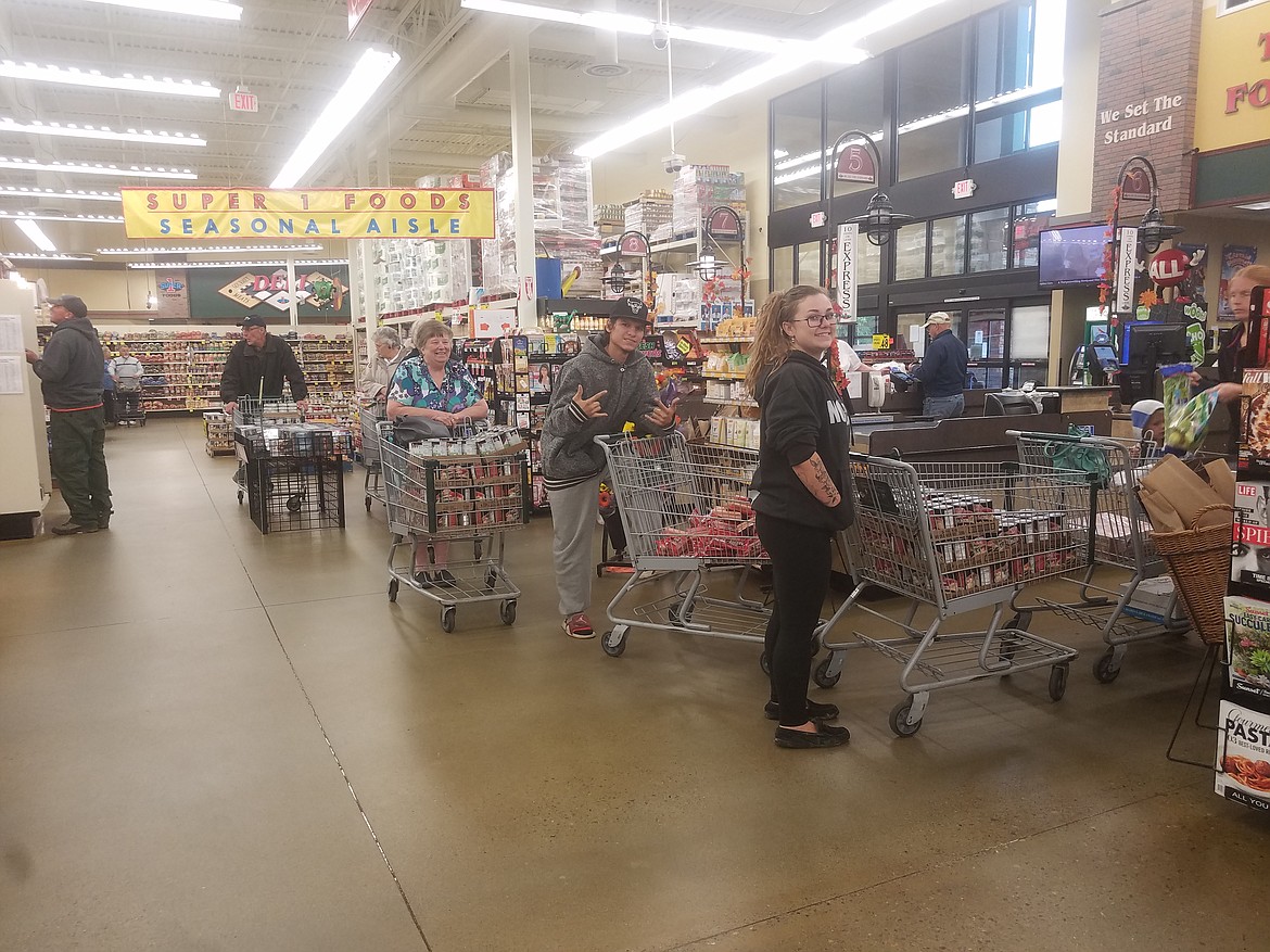 Photos By Tanna Yeoumans
Savannah Cromwell and Joseph Tobar took time out of their day to help the Shriners collect food for the Naples Food Cupboard.