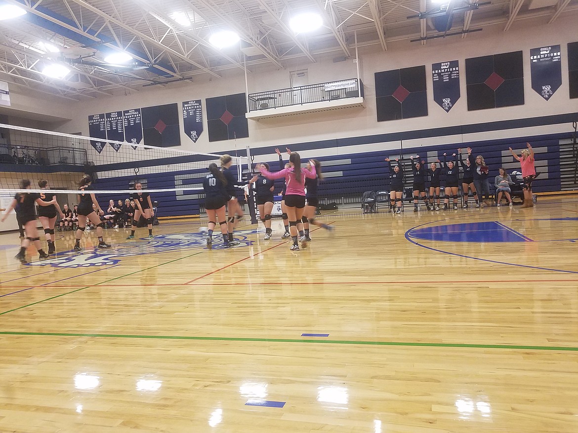 Photo By Tanna Yeoumans
Badgers Volleyball girls come together in celebration after scoring.