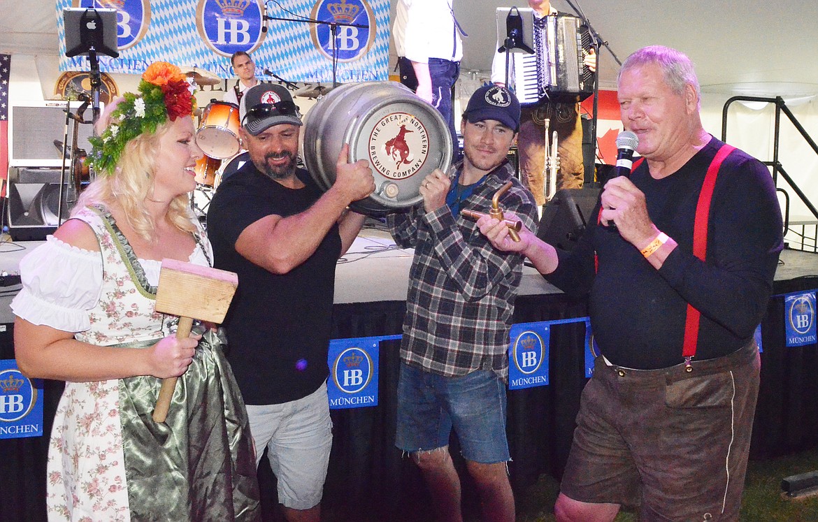 The ceremonial tapping of the first keg got events going Thursday evening at the Great Northwest Oktoberfest at Depot Park.