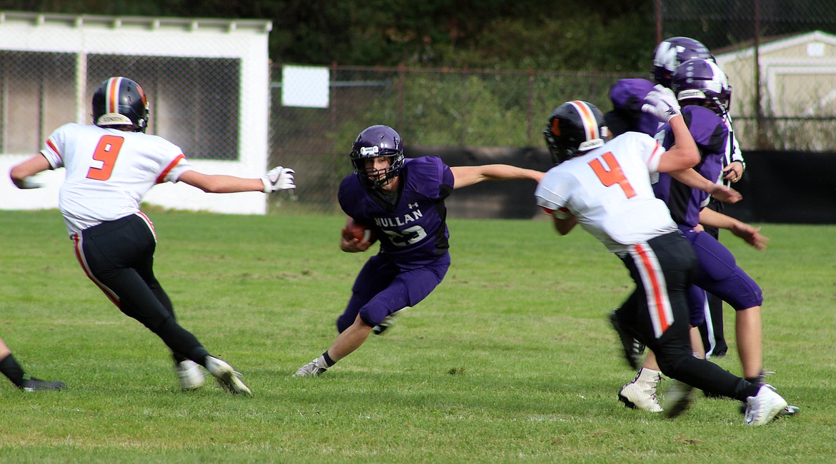 Photo by Chanse Watson/ 
Sheldon Trogden weaves through Kendrick defenders during the Tigers 52-8 loss.