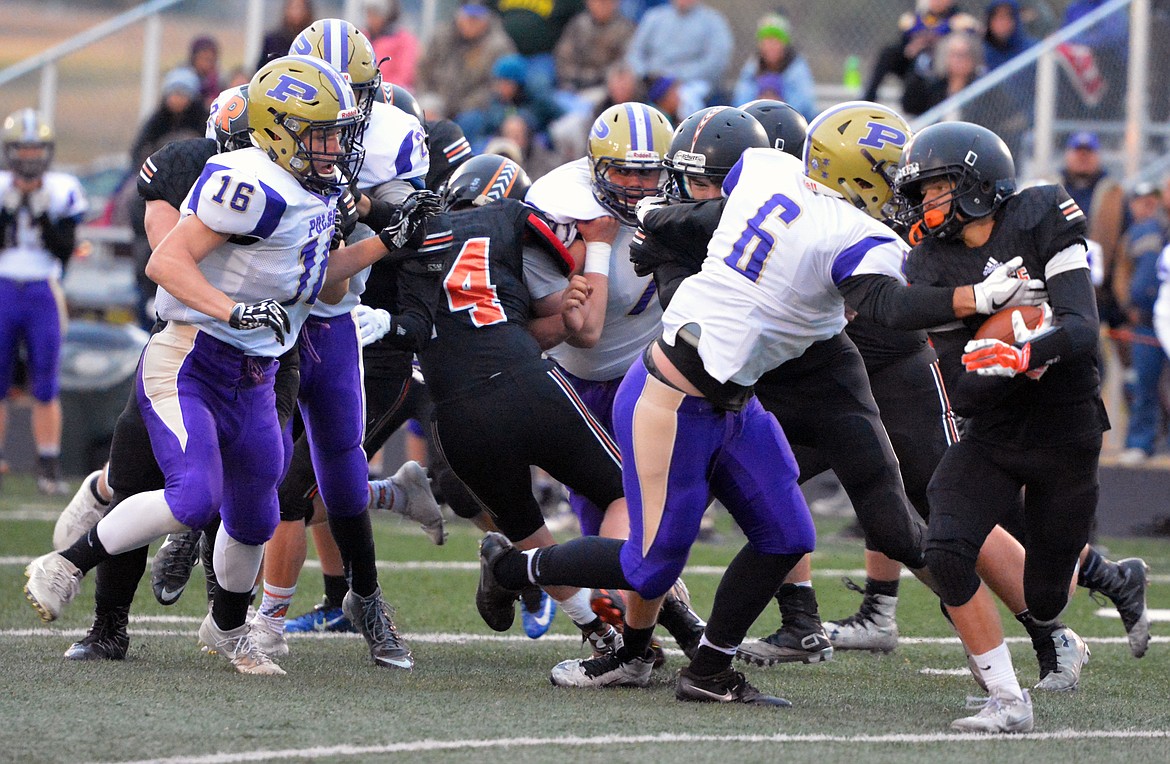 POLSON LB Kyle Druyvestein (left) and Haden Smith (right) converges on the Ronan ball carrier in the first half of the Ronan-Polson game Friday night at Ronan High School. With the loss, the Pirates&#146; record now falls to 0-4 and 0-1 in conference play. This game marked the first time since the year 2000 that Ronan defeated Polson in a meaningful contest. The Chiefs defeated Polson during at home in the year 2000. (Jason Blasco/Lake County Leader)