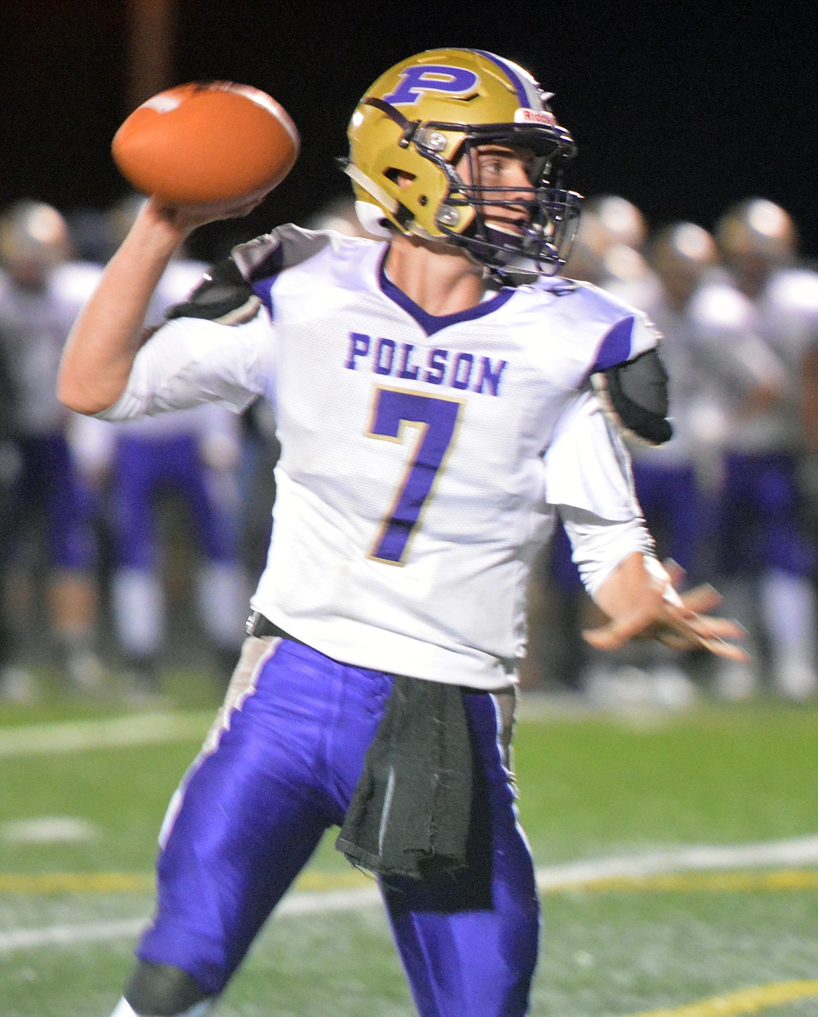 POLSON PIRATE quarterback Bo Kelley attempts to throw a pass in the Ronan-Polson rivarly game Friday night at Ronan High School. Kelley looks to lead the Pirates to theri first victory against Libby at 7 p.m. Friday night at Polson High School. (Jason Blasco/Lake County Leader)