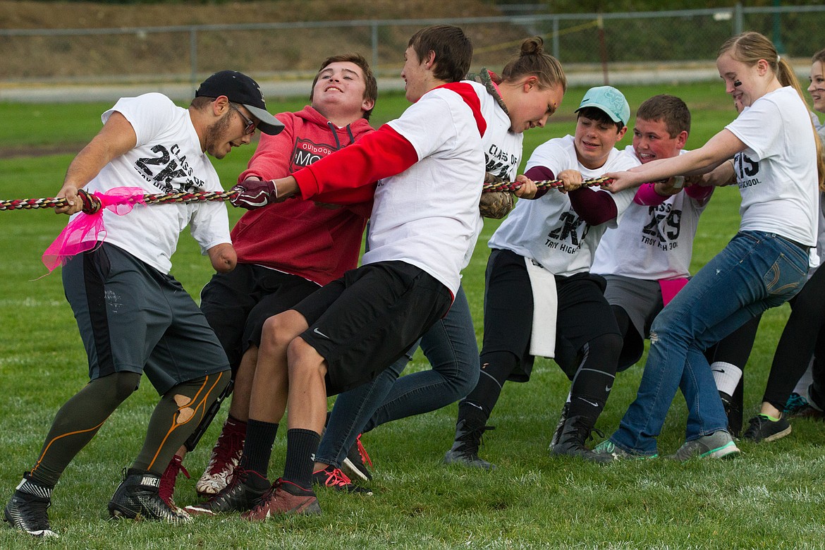 Middle left: Troy High School juniors compete in a tug of war Wednesday night during a homecoming event. (John Blodgett/The Western News)