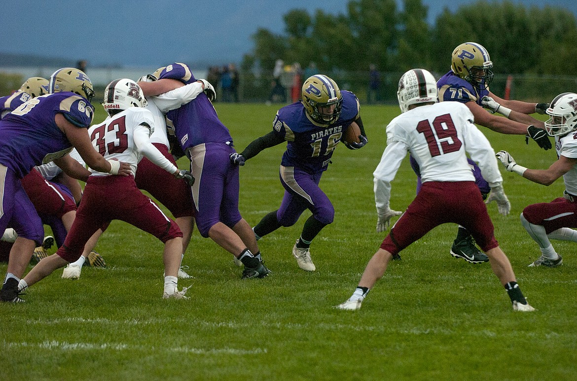 Polson&#146;s Kyle Druyvestein carries the ball in the first quarter at home against Hamilton Friday. (Jeremy Weber photo)