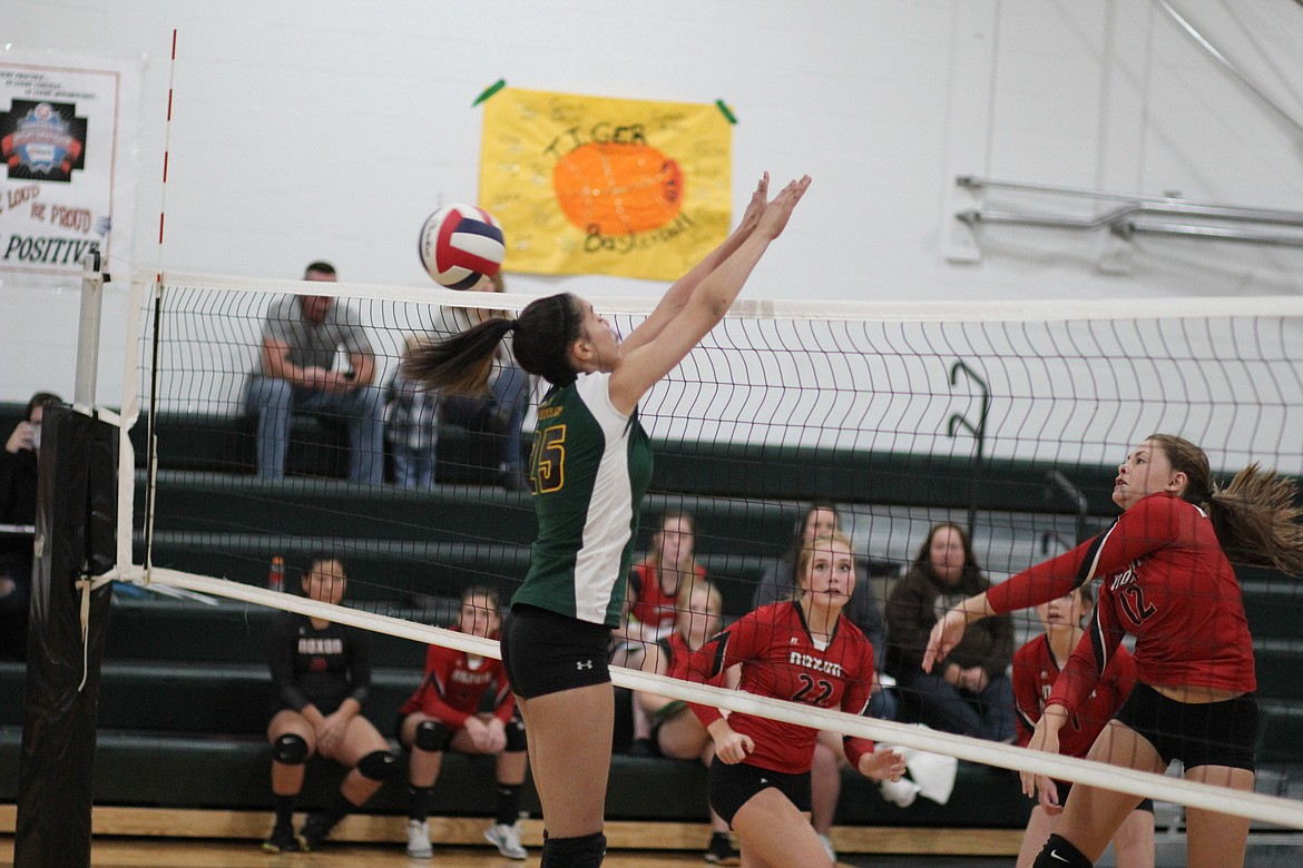 St. Regis Justice Tate attempts a block during the match against Noxon on Friday night at home. The Tigers were defeated 25-16, 28-26, 26-24. (Kathleen Woodford/Mineral Independent).
