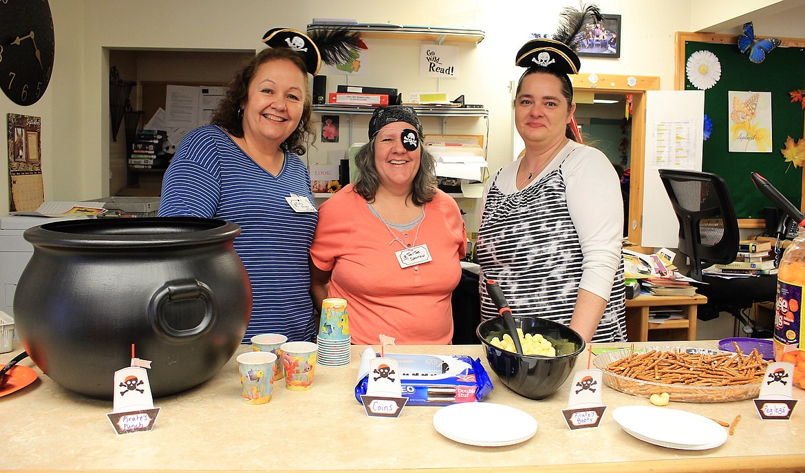 Mates Florence Evans (Fishy Slappy McGee), Vicki Brown (Two-toe Sparrow) and Echo Hayder (Captain Flag Fishhawk) serve up some grub to the crew including pirate punch, chocolate coins (Oreos), cannon balls (cheese puff balls), peg legs (pretzels) and pirates booty (cheese puffs).