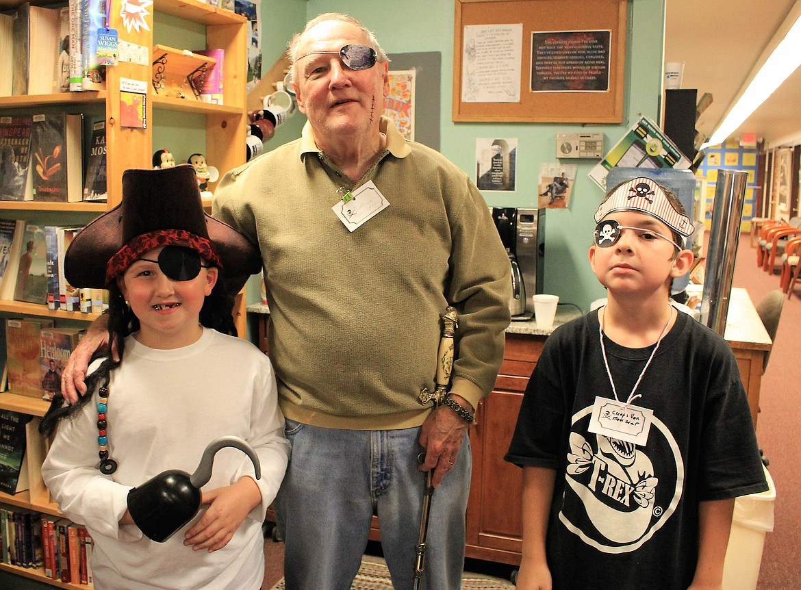 Captain Ruthless Von Joe (Roger Brown) hangs out with two young buccaneers Jaymson Russo (Money Bucket Sparrow, left) and Connor Gage Jordan (Creeps Von Moonscar, right). (Kathleen Woodford/Mineral Independent)
