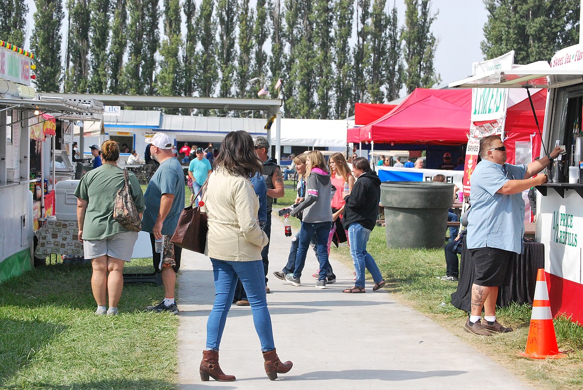 Bob Kirkpatrick/The Sun Tribune - Fairgoers were in search of goodies on a sunny Wednesday afternoon.