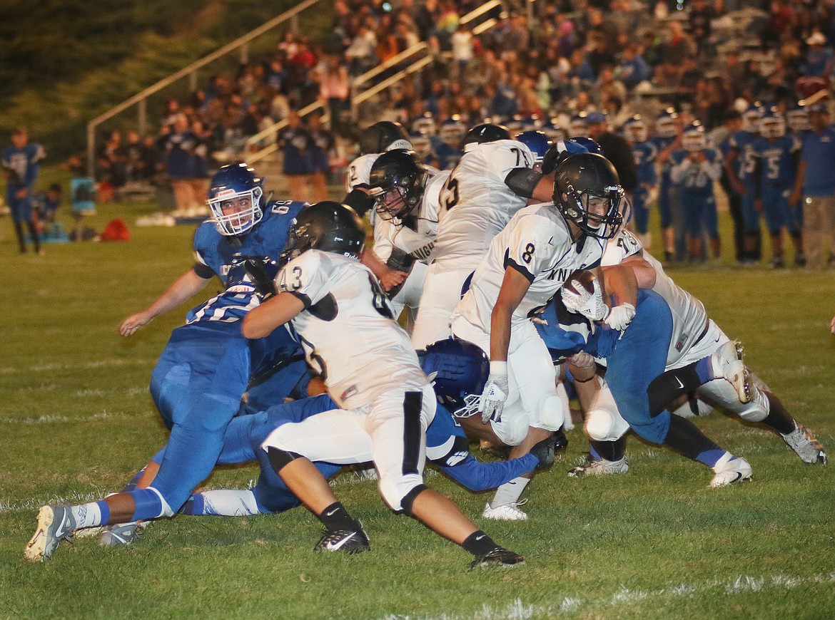 Pete Christensen photo - Lorzenzo Myrick busts loose for one of his two rushing touchdowns.