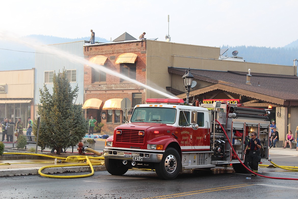 Photo by Chnase Watson/ 
A Kellogg Fire truck hoses down the McConnell.