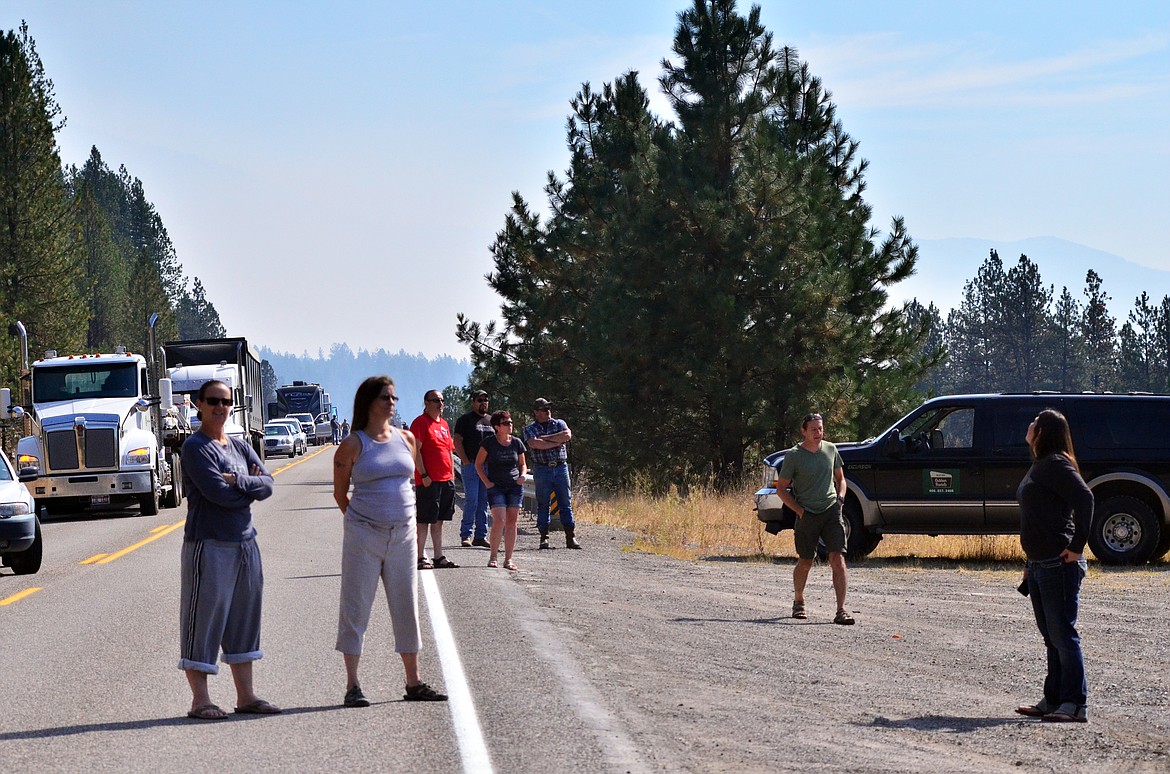 People poured out of their cars to watch, take photos and film the air attack with great admiration to the pilots working the two fires. (Erin Jusseaume/ Clark Fork Valley Press)