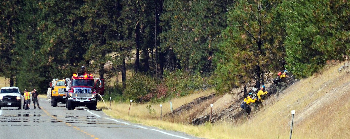 Ground crews moving into one of the fires. (Erin Jusseaume/ Clark Fork Valley Press)