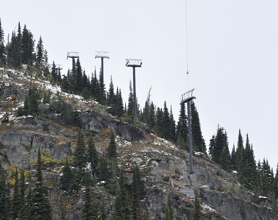 One of the chairlift towers is delivered by helicopter Sunday morning as part of the Chair 5 relocation to the East Rim from Ptarmigan Bowl at Whitefish Mountain Resort. (Heidi Desch/Whitefish Pilot)