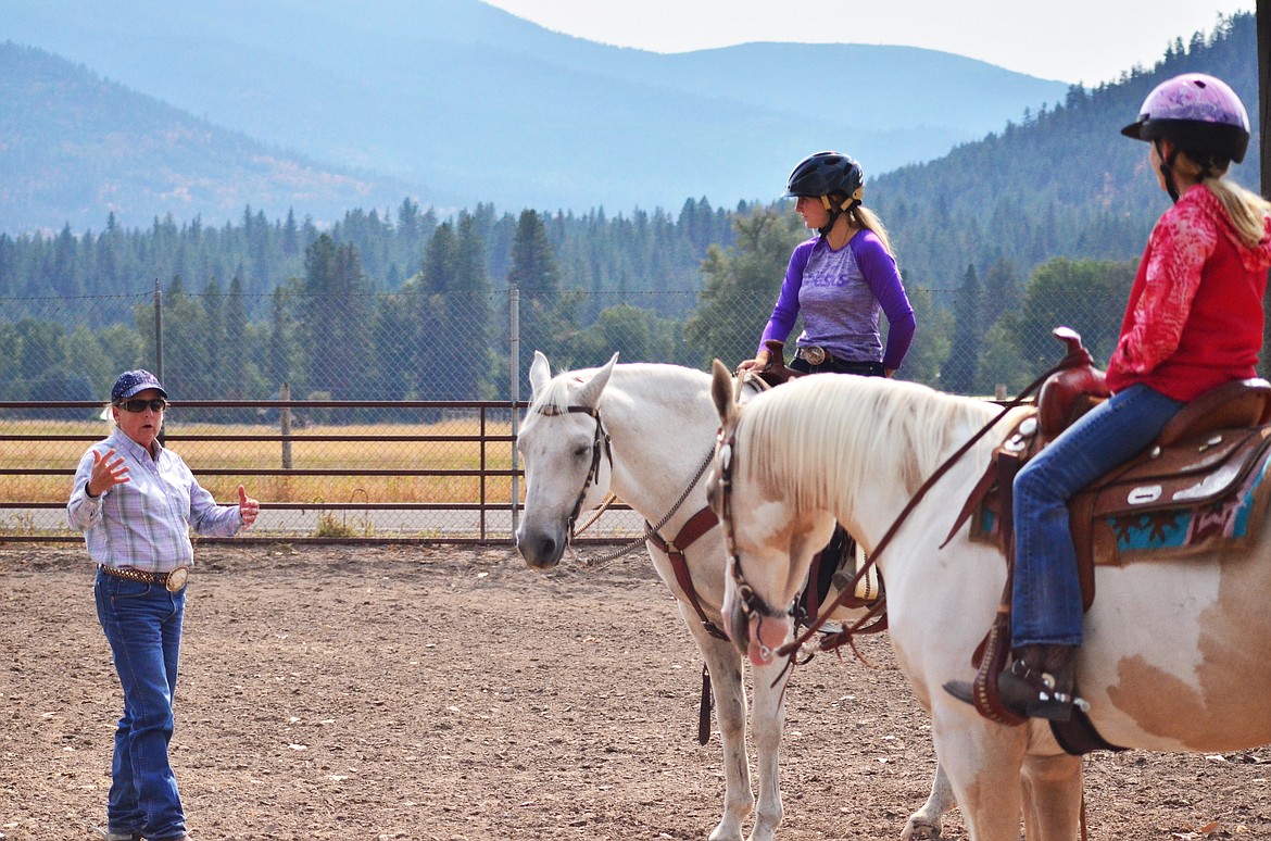 Missoula coach Laura Bakker talking to Jessica and Sydnee during the practice. (Erin Jusseaume/ Clark Fork Valley Press)