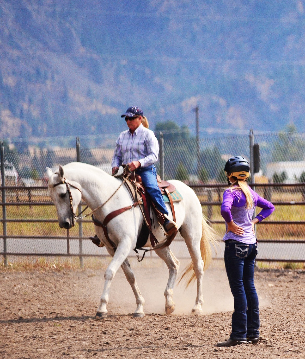 Laura coaching from the saddle to help Jessica prepare for the upcoming state show. (Erin Jusseaume/ Clark Fork Valley Press)