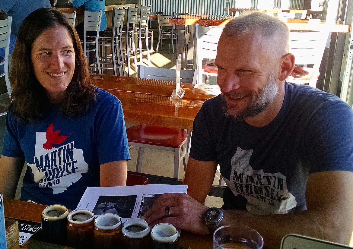 BRIAN WALKER/Press
Monte Martin, the great great grandson of Post Falls founder Frederick Post, and his wife Marisol chat with Post Falls Historian Kim Brown on Thursday at Post Falls Brewing.