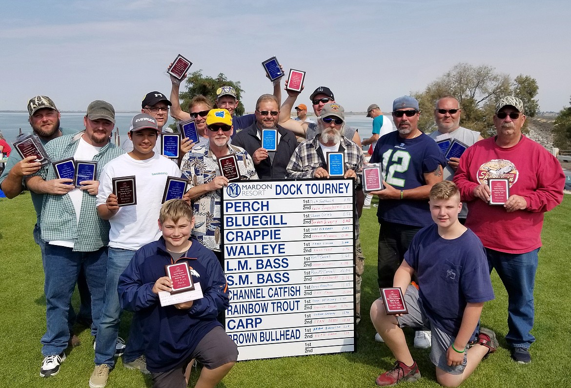 Winners of the 13th Annual MarDon Resort Marathon Dock Tournament show off their trophies and checks. Total payout was $506.00 per species &#151; split between first and second place.