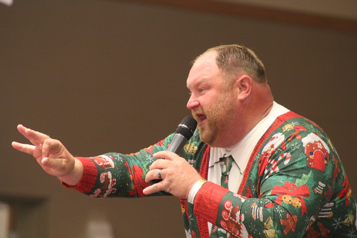 Richard Byrd/Columbia Basin Herald
Chuck Yarbro auctions off an item during the live auction portion of Saturday night&#146;s event at Big Bend Community College.