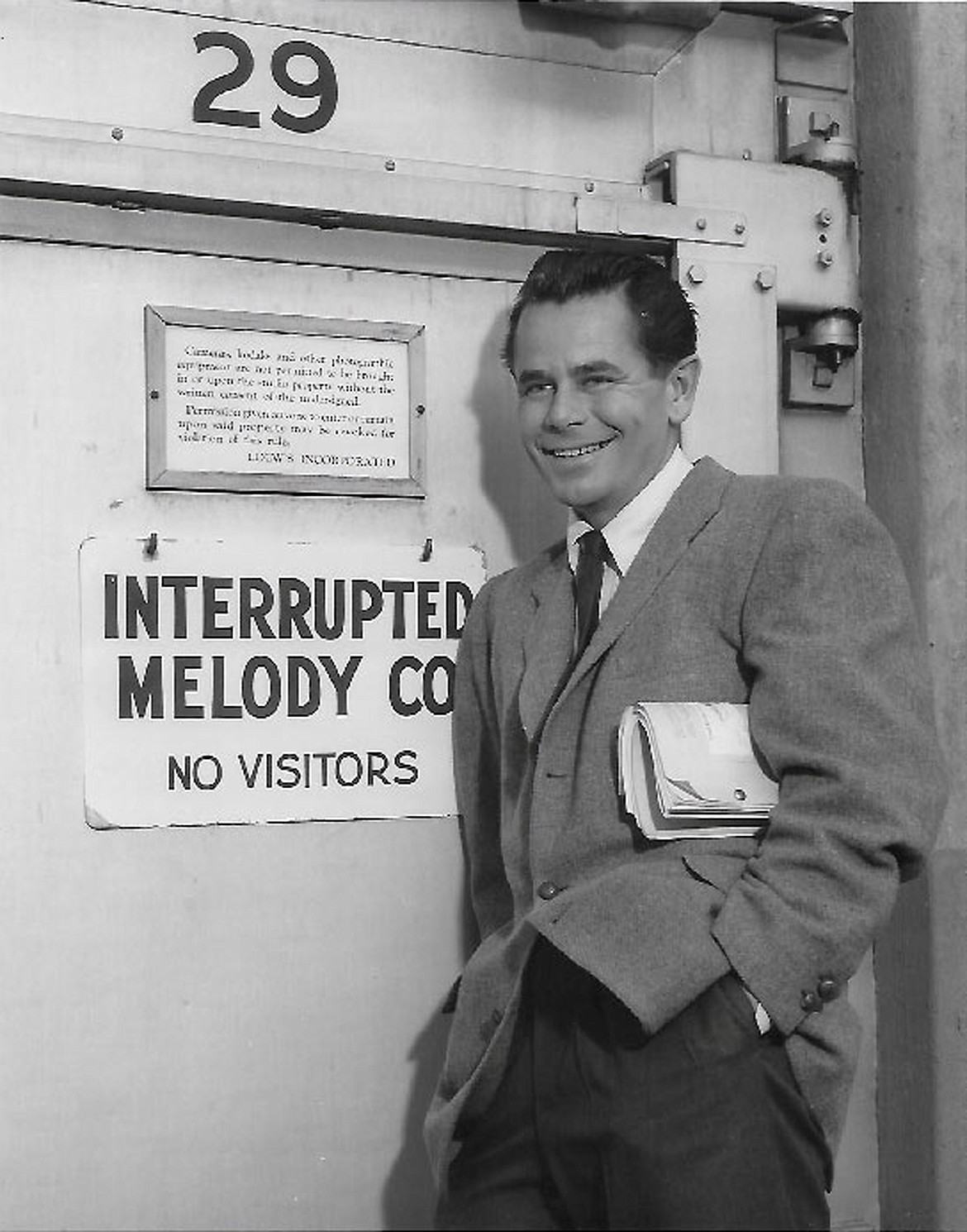 Glenn Ford stands outside the stage door of the Interrupted Melody MGM stage. (Photo courtesy of Peter Ford)